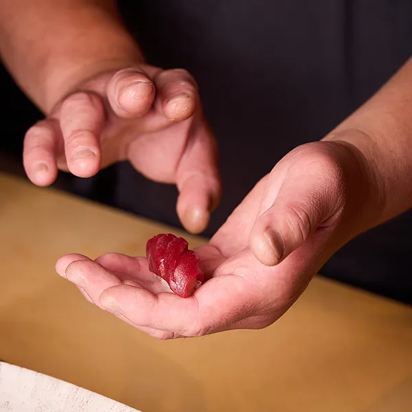 Sushi Chef makes nigiri sushi at omakase counter